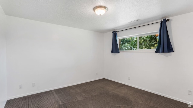 906 N Fort Canyon Rd, Alpine, UT 84004 - empty room with a textured ceiling, baseboards, and dark carpet
