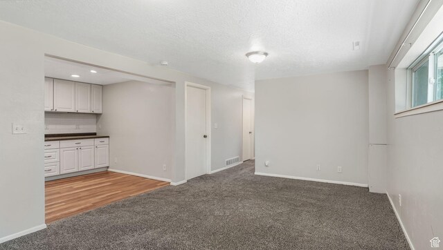 906 N Fort Canyon Rd, Alpine, UT 84004 - basement with carpet flooring, baseboards, recessed lighting, and a textured ceiling