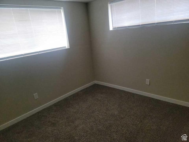 4520 S Ridgeline Dr, Washington Terrace, UT 84405 - empty room featuring dark colored carpet and baseboards