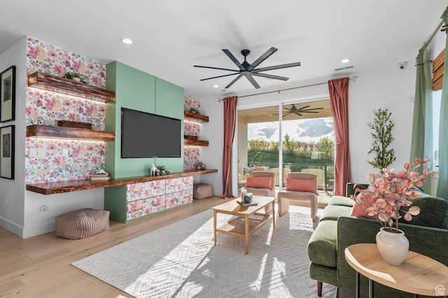 living area with ceiling fan, wood finished floors, and recessed lighting