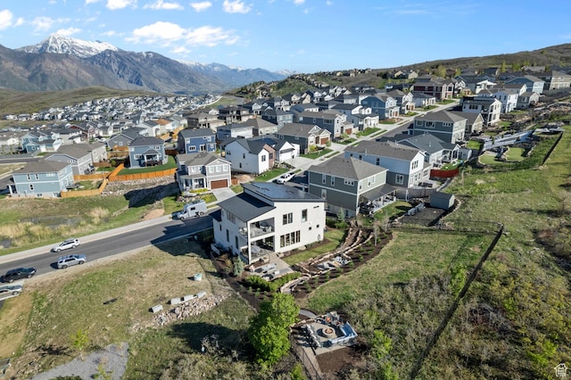 aerial view of residential area featuring a mountain backdrop