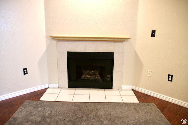 147 W 600 N Unit 111, Tooele, UT 84074 - detailed view of wood finished floors, a fireplace, and baseboards