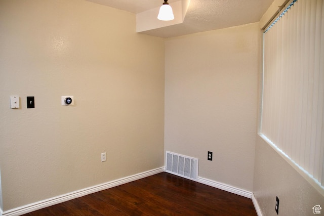 147 W 600 N Unit 111, Tooele, UT 84074 - laundry area featuring electric dryer hookup, wood finished floors, and baseboards