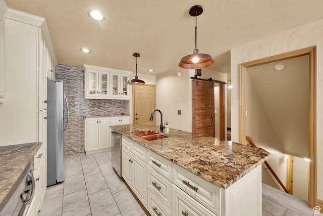 8135 S Clover Spring Ln E, Cottonwood Heights, UT 84121 - kitchen with appliances with stainless steel finishes, a sink, a barn door, white cabinets, and recessed lighting