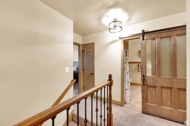 8135 S Clover Spring Ln E, Cottonwood Heights, UT 84121 - hall featuring an upstairs landing, light colored carpet, and a barn door