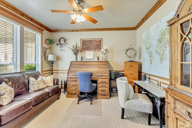 office featuring light carpet, wainscoting, crown molding, and ceiling fan