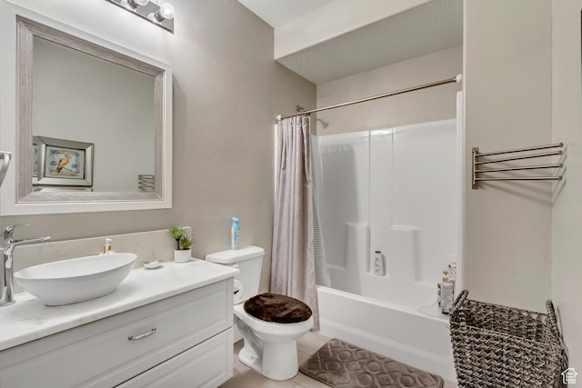 full bath featuring toilet, shower / bath combo with shower curtain, vanity, and tile patterned flooring