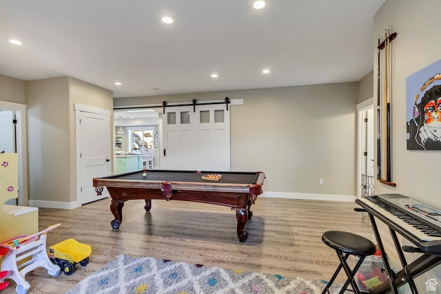 game room featuring wood finished floors, baseboards, recessed lighting, billiards table, and a barn door