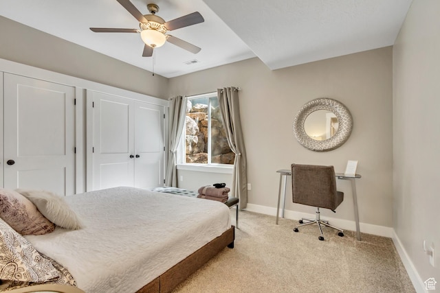 bedroom with light carpet, baseboards, and ceiling fan