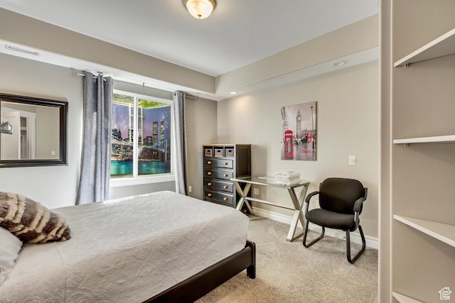 carpeted bedroom featuring baseboards