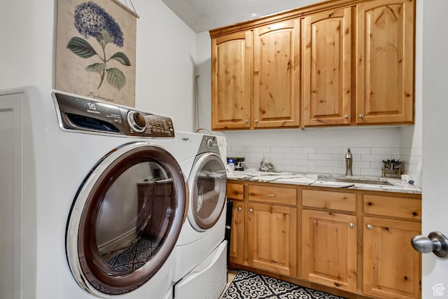 laundry area with cabinet space and washer and clothes dryer