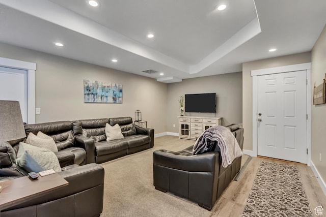 living area with recessed lighting, baseboards, and light wood finished floors