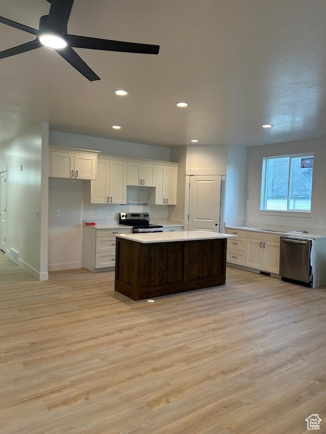 244 E 300 N, Payson, UT 84651 - kitchen with stainless steel appliances, light wood-type flooring, light countertops, a center island, and ceiling fan
