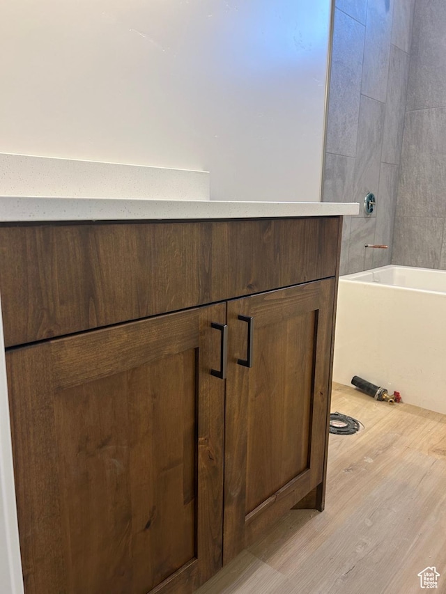 244 E 300 N, Payson, UT 84651 - bathroom view of wood finished floors, vanity, and washtub / shower combination