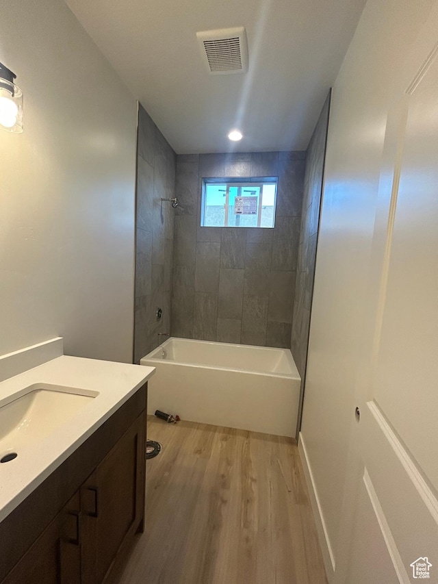 244 E 300 N, Payson, UT 84651 - bathroom featuring wood finished floors, vanity, and washtub / shower combination