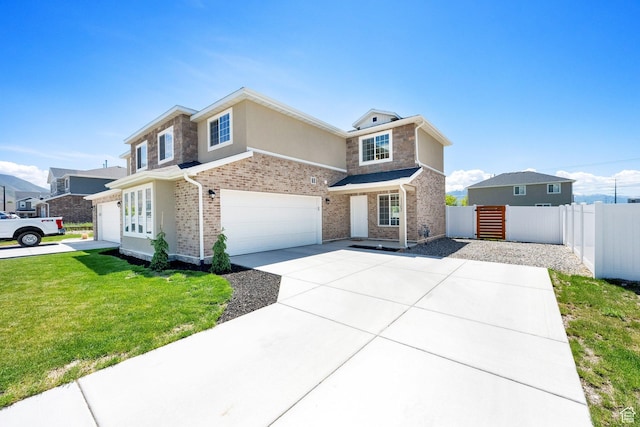 traditional home with an attached garage, driveway, stucco siding, brick siding, and stone siding