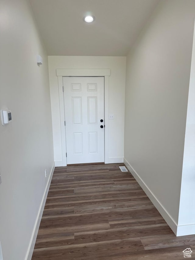 doorway to outside with baseboards, recessed lighting, and dark wood-style floors