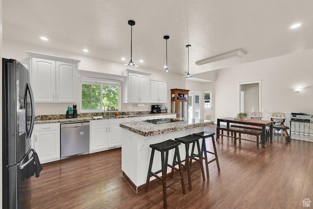 1159 E 5700 S, South Ogden, UT 84405 - kitchen featuring black appliances, dark wood-style floors, white cabinets, light stone countertops, and a center island