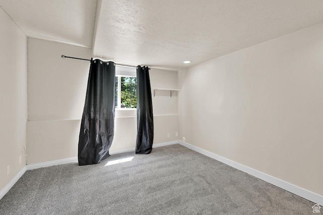 1159 E 5700 S, South Ogden, UT 84405 - spare room featuring a textured ceiling, carpet flooring, and baseboards