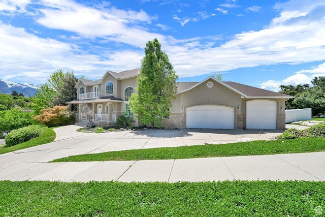1159 E 5700 S, South Ogden, UT 84405 - view of front of house featuring concrete driveway, a garage, stucco siding, and covered porch