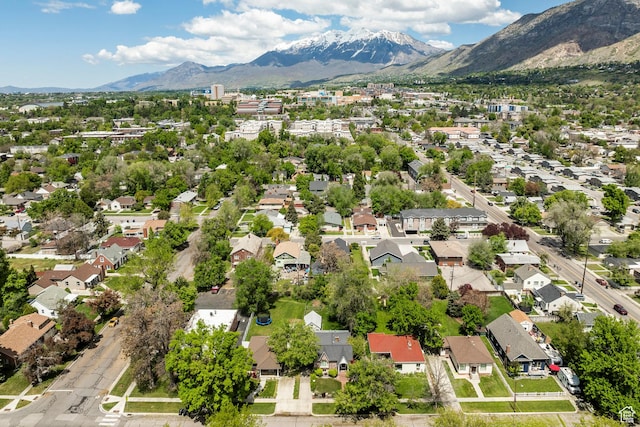 aerial view of residential area featuring a mountainous background