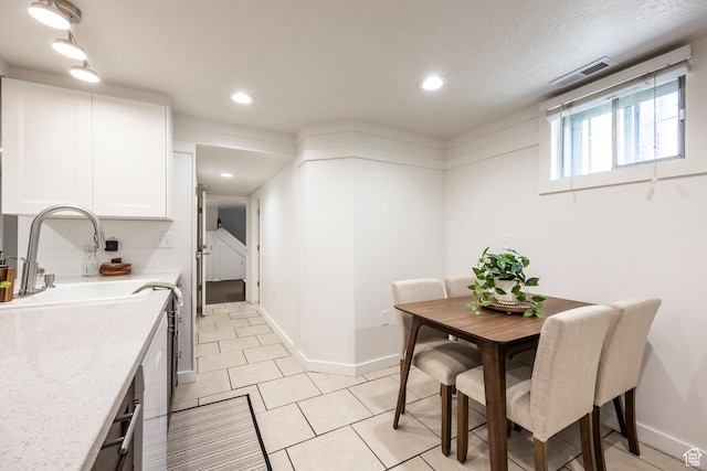 dining space with baseboards, light tile patterned floors, and recessed lighting