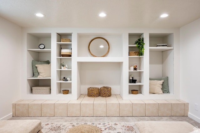 detailed view of built in features, baseboards, and recessed lighting