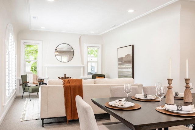 dining area with crown molding and recessed lighting