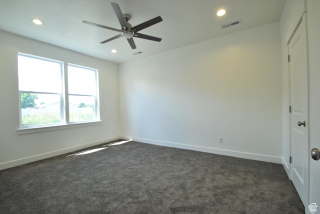 unfurnished room with dark colored carpet, recessed lighting, a ceiling fan, and baseboards