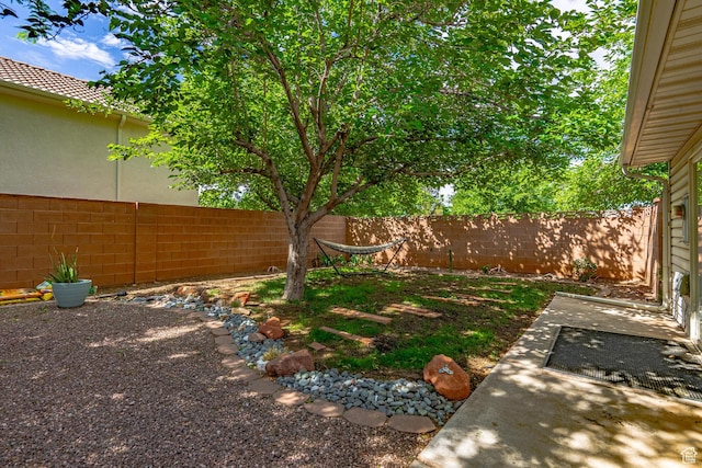 fenced backyard featuring a patio