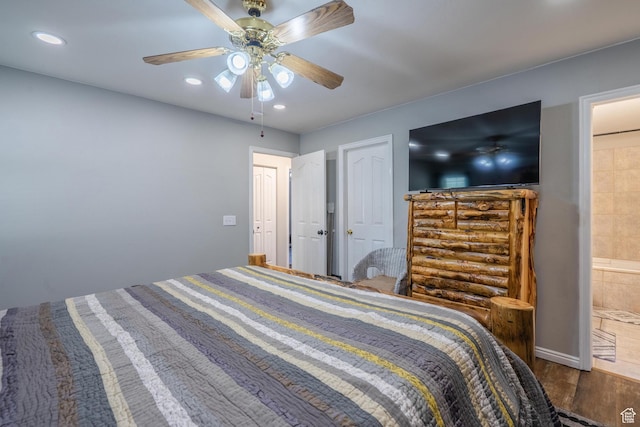 bedroom featuring wood finished floors, recessed lighting, a ceiling fan, and ensuite bathroom