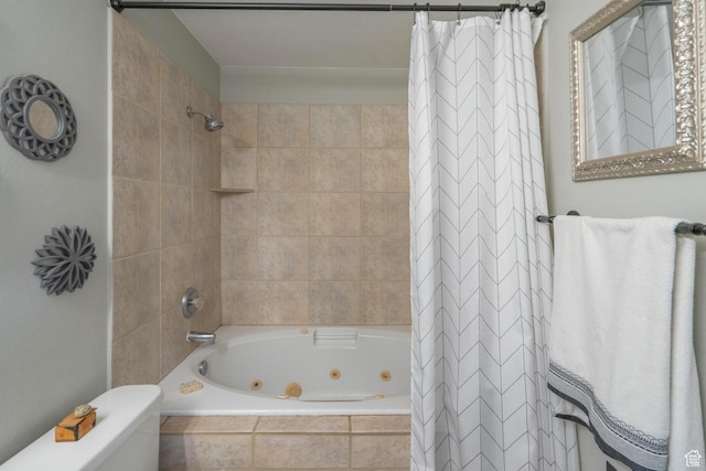 bathroom with a combined bath / shower with jetted tub and toilet