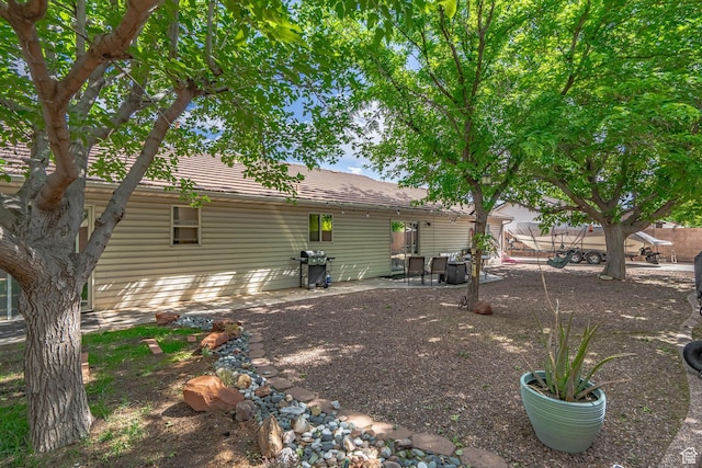 back of house with a patio area