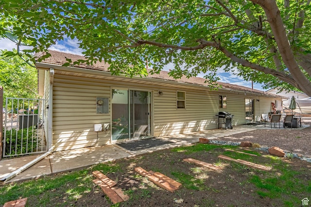 back of property featuring a patio