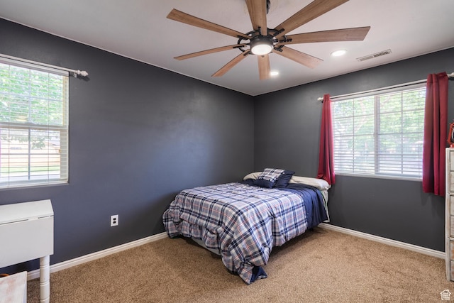 carpeted bedroom featuring baseboards, a ceiling fan, and recessed lighting