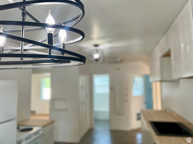 kitchen featuring stove and freestanding refrigerator
