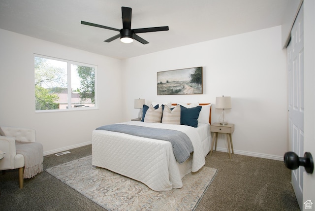 bedroom with carpet flooring, a closet, baseboards, and a ceiling fan