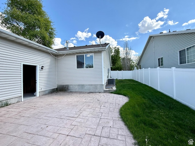 back of house featuring a patio area and central AC