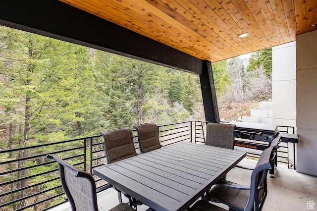 9335 N Canopy Ln E, Sundance, UT 84604 - view of patio / terrace featuring a balcony, a forest view, and outdoor dining space