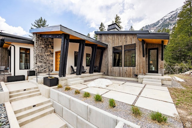 9335 N Canopy Ln E, Sundance, UT 84604 - rear view of property featuring a patio and stone siding