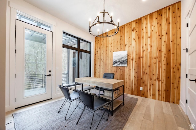 9335 N Canopy Ln E, Sundance, UT 84604 - dining room with a chandelier, wood walls, an office area, and wood finished floors