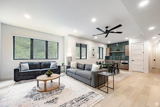 9335 N Canopy Ln E, Sundance, UT 84604 - living area featuring a ceiling fan, recessed lighting, light wood-style flooring, and baseboards
