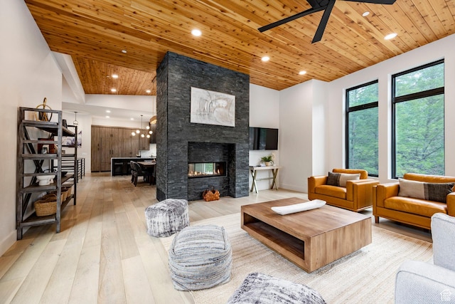 9335 N Canopy Ln E, Sundance, UT 84604 - living room with wooden ceiling, hardwood / wood-style floors, ceiling fan, a stone fireplace, and recessed lighting