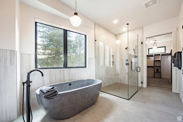 9335 N Canopy Ln E, Sundance, UT 84604 - full bathroom with a stall shower, a freestanding tub, and tile walls