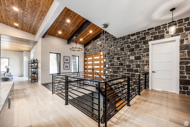 9335 N Canopy Ln E, Sundance, UT 84604 - hall with an upstairs landing, high vaulted ceiling, wood-type flooring, beam ceiling, and recessed lighting