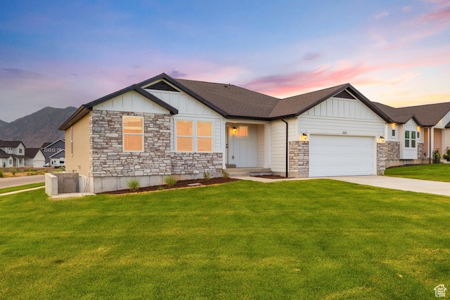 309 N 2350 E Unit 01, Spanish Fork, UT 84660 - view of front facade featuring board and batten siding, stone siding, an attached garage, and concrete driveway