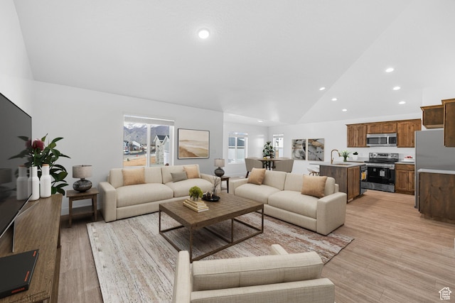 309 N 2350 E Unit 01, Spanish Fork, UT 84660 - living room with vaulted ceiling, recessed lighting, and light wood-style floors