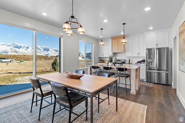 101 N 950 E Unit 36, Tremonton, UT 84337 - dining area featuring recessed lighting, a mountain view, dark wood-style flooring, and a chandelier