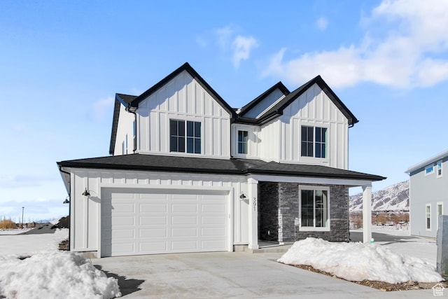 101 N 950 E Unit 36, Tremonton, UT 84337 - view of front of home featuring board and batten siding, an attached garage, and driveway