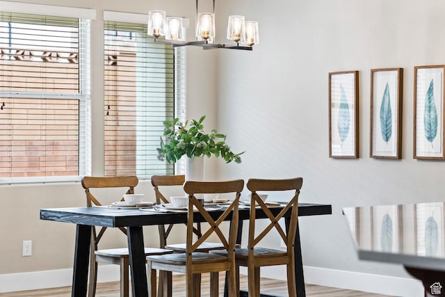 1095 S White Sands Dr, Washington, UT 84780 - dining space featuring baseboards, a chandelier, and wood finished floors